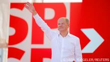 SPD Chancellor candidate Olaf Scholz gestures during an event to kick off his campaign, in Bochum, Germany, August 14, 2021. REUTERS/Leon Kuegeler