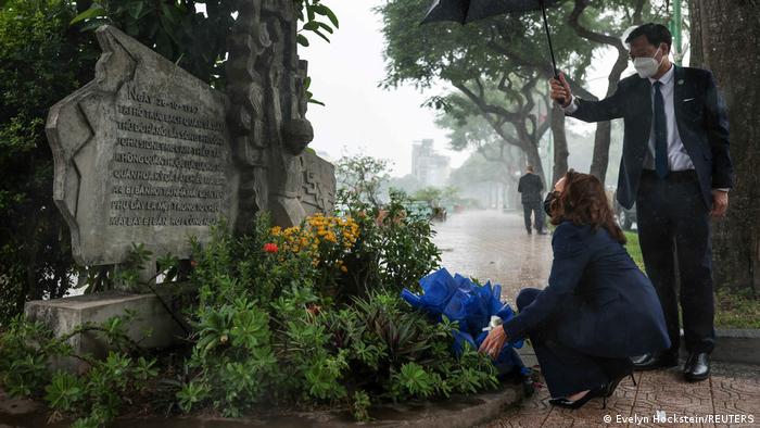 US Vice President Kamala Harris lays flowers at the Senator John McCain memorial site, where his Navy aircraft was shot down by the North Vietnamese, on the third anniversary of his death
