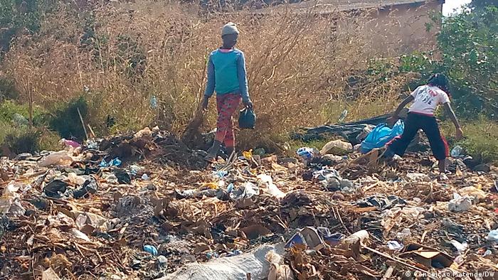Children work collecting garbage at a dump site