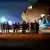Afghan evacuees leave a U.S. C-17 Globemaster after arriving to Ali Al Salem Air Base, Kuwait