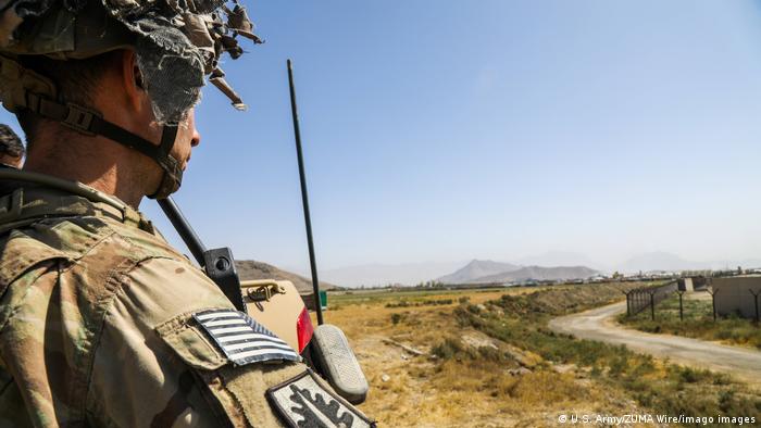 A Paratrooper assigned 1st Brigade Combat Team, 82nd Airborne Division scans his sector as he conducts security as part of a non-combatant evacuation NEO operation in Kabul
