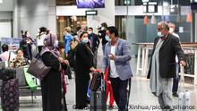 (210820) -- FRANKFURT, Aug. 20, 2021 (Xinhua) -- Passengers of a flight of Lufthansa bringing evacuees from Afghanistan arrive at Frankfurt International Airport, in Frankfurt, Germany, Aug. 20, 2021. (Photo by Armando Babani/Xinhua)