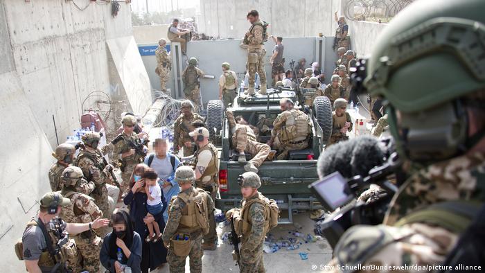 Soldiers try to bring order to chaotic Kabul evacuations