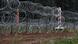 A fence built by Polish soldiers is seen on the border between Poland and Belarus A fence built by Polish soldiers is seen on the border between Poland and Belarus