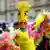 Colgone Pride parade participant wears rainbow face mask 