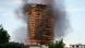 Smoke billowing from the high-rise tower in Milan Smoke billowing from the high-rise tower in Milan