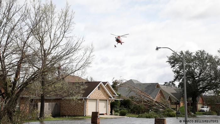 A rescue helicopter flying over some houses