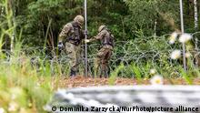 Poland Erects A Border Between Belarus And The EU
Polish Army Soldiers build a fence with concertina wire at the Belarusian border in order to stop immigrants from entering the country in Krynki, Poland on 27 August, 2021. In August only more than 2000 immigrants entered Poland from Belarus. The Polish government decided to build a fence to put a stop to an influx of migrants walking across the Belarus border. The border between Belarus and Poland is also the border of the European Union. Poland accuses the Lukashenko regime of orchestrating the transit of thousands of migrants from the Middle East to put pressure on the EU. (Photo by Dominika Zarzycka/NurPhoto)