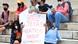 A person holding a sign that reads NO!! Texas abortion ban! Outraged!! A person holding a sign that reads NO!! Texas abortion ban! Outraged!!