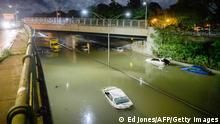 Floodwater surrounds vehicles following heavy rain on an expressway in Brooklyn, New York early on September 2, 2021, as flash flooding and record-breaking rainfall brought by the remnants of Storm Ida swept through the area. (Photo by Ed JONES / AFP) (Photo by ED JONES/AFP via Getty Images)