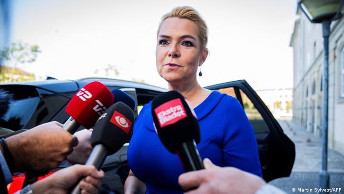 Former Danish Immigration Minister Inger Stojberg talks with journalists as she arrives for her trial