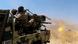Fighters loyal to Yemen's Saudi-backed government fire a weapon mounted on the back of a truck Fighters loyal to Yemen's Saudi-backed government fire a weapon mounted on the back of a truck