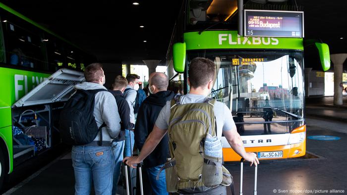 Travelers in Munich wait to board a long-distance Flixbus coach bound for Budapest