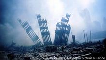 The rubble of the World Trade Center smoulders following a terrorist attack 11 September 2001 in New York. A hijacked plane crashed into and destroyed the landmark structure. dpa +++ dpa-Bildfunk +++