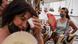 Women keep cool with fans at a flea market in Madrid, Spain Women keep cool with fans at a flea market in Madrid, Spain