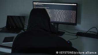 Hacker in front of a computer screen