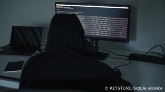 Hacker in front of a computer screen