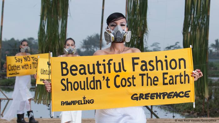 Models on the background of a rice field with banners in their hands