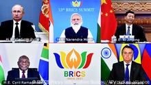 This handout photograph provided by the Press Information Bureau shows leaders of the BRICS nations, clockwise from top left, Russian President Vladimir Putin, Indian Prime Minister Narendra Modi, Chinese President Xi Jinping, South African President Cyril Ramaphosa and Brazilian President Jair Bolsonaro during a video conference, in New Delhi, India, Thursday, Sept. 9, 2021. Leaders of the BRICS grouping on Thursday emphasized the need for cooperation on studying the origins of the coronavirus as an important element in the global fight against the COVID-19 pandemic. This year's summit was held virtually and marked the 15th anniversary of the grouping, which includes Brazil, India, China, South Africa and Russia. Together, the five countries represent nearly half of the world's population. (Press Information Bureau via AP)