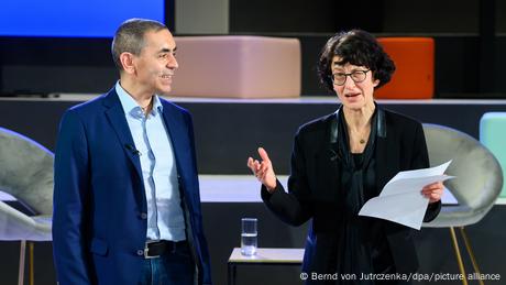 Özlem Türeci (right) and Ugur Sahin speak on stage