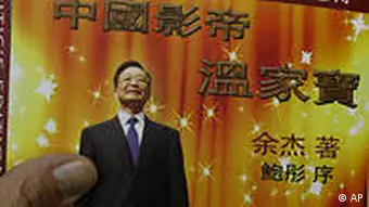 A copy of the new book China's Best Actor: Wen Jiabao authored by Yu Jie is picked up as they are displayed for sale at a bookstore in Hong Kong Monday, Aug. 16, 2010. The book by Chinese dissident author Yu who says he was threatened with imprisonment argues China's premier is not a reformist nor a man of the people, as popularly perceived at home, but a mediocre technocrat who rose to power through good acting. (AP Photo/Kin Cheung)