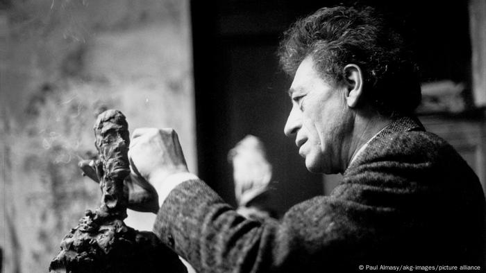Alberto Giacometti working on a sculpture
