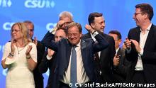 Christian Democratic Union (CDU) leader and chancellor candidate Armin Laschet (C) gestures after addressing a congress of the CDU's sister party Christian Social Union CSU in Nuremberg, southern Germany, on September 11, 2021. (Photo by CHRISTOF STACHE / AFP) (Photo by CHRISTOF STACHE/AFP via Getty Images)