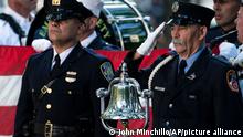 A ceremonial bell rests on a stage podium at the start of ceremonies to commemorate the 20th anniversary of the Sept. 11 terrorist attacks, Saturday, Sept. 11, 2021, at the National September 11 Memorial
