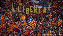 11.09.2021
People hold up Estelada flags (Catalan separatist flag) during Catalonia's national day, 'La Diada', in Barcelona, Spain, September 11, 2021. The banner reads freedom. REUTERS/ Albert Gea
