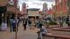 People walking while other sit at a city square in Namibia's capital Windhoek. People walking while other sit at a city square in Namibia's capital Windhoek.