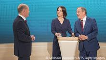 (L-R) Olaf Scholz, German Finance Minister, Vice-Chancellor and the Social Democrats (SPD) candidate for Chancellor, Annalena Baerbock co-leader of Germany's Greens and her party's candidate for Chancellor and Armin Laschet, North Rhine-Westphalia's State Premier and the Christian Democratic Union (CDU) candidate for Chancellor attend an election TV debate in Berlin on September 12, 2021, ahead of general elections taking place on September 26, 2021. (Photo by Michael Kappeler / POOL / AFP) (Photo by MICHAEL KAPPELER/POOL/AFP via Getty Images)