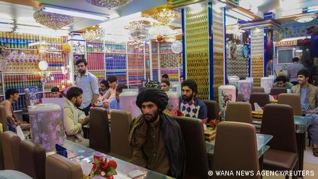 Afghan men are seen in a restaurant in Herat, Afghanistan September 10, 2021