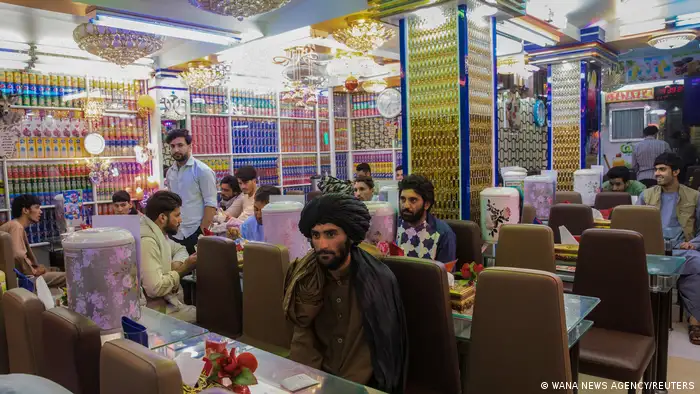 Afghan men are seen in a restaurant in Herat, Afghanistan September 10, 2021