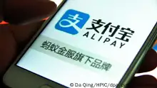 --FILE--A Chinese netizen uses the app of Alipay, the online payment service of Alibaba's Ant Financial, on his smartphone, in Ji'nan city, east China's Shandong province, 12 September 2016. Ant Financial Services Group, the online finance firm backed by billionaire Jack Ma, will extend its online consumer credit service to four million retail businesses across the country to boost sales and encourage spending - as China's consumers increasingly feel more comfortable shopping with borrowed money. Zou Liang, vice-president of Alipay Business Unit at Ant Financial, said that sales surged by an average 41 percent per client year-on-year from 2015 to 2016 after a number of retailers adopted Huabei, or Ant Check Later, a loan and installment service. Foto: Da Qing/HPIC/dpa