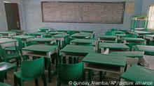 FILE - In this Monday, March 1, 2021 file photo, empty desks and chairs are seen at the Government Girls Secondary School where more than 300 girls were abducted by gunmen on Friday, in Jangebe town, Zamfara state, northern Nigeria. Schools in northern Nigeria are on high alert after the kidnappings at the Salihu Tanko Islamic School in Niger state on Sunday, May 30, 2021 marked the latest in a long spate of violent abductions carried out for ransom this year by unknown attackers in the north. (AP Photo/Sunday Alamba, File)