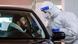 A worker administers a COVID test at a drive-through testing site in Cologne, Germany A worker administers a COVID test at a drive-through testing site in Cologne, Germany