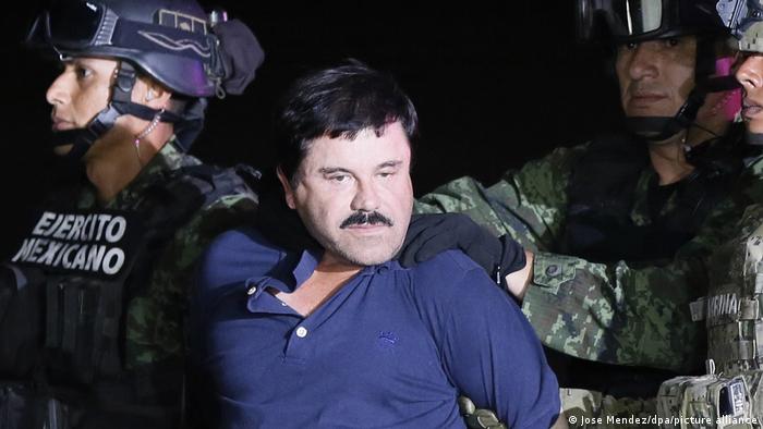 Joaquin Guzman aka El Chapo being led away by Mexican troops