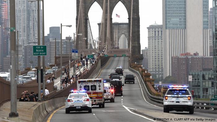 Prison van surrounded by police cars on its way over Brooklyn Bridge 