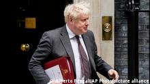 Britain's Prime Minister Boris Johnson leaves 10 Downing Street as he makes his way to Parliament to attend the weekly Prime Minister Questions session, in London, Wednesday, Sept. 15, 2021. (AP Photo/Alberto Pezzali)