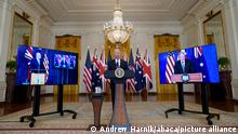 President Joe Biden, joined virtually by Australian Prime Minister Scott Morrison and British Prime Minister Boris Johnson, speaks about a national security initiative from the East Room of the White House in Washington