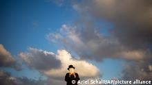 An Ultra-Orthodox Jewish man of the Kiryat Sanz Hassidic sect prays on a hill overlooking the Mediterranean Sea as they participate in a Tashlich ceremony, in Netanya, Israel, Tuesday, Sept. 14, 2021. Tashlich, which means to cast away in Hebrew, is the practice in which Jews go to a large flowing body of water and symbolically throw away their sins by throwing a piece of bread, or similar food, into the water before the Jewish holiday of Yom Kippur, which starts at sundown on Wednesday. (AP Photo/Ariel Schalit)