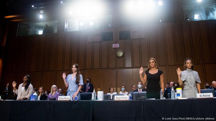 U.S. Olympic gymnasts take an oath to testify.