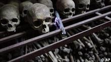 **ADVANCE FOR SUNDAY, JAN. 24** In this Sept. 27, 2009 photo, skulls and bones from some of the estimated 10,000 Tutsis killed in a two-day massacre at Nyamata church during the 1994 genocide, are displayed in a crypt behind the church, now a memorial to the genocide, in the town of Nyamata, 30 kilometers outside Kigali, Rwanda. Callixte Mbarushimana is on Interpol's Wanted List for the crime of genocide in his native Rwanda where he is accused of having planned and executed the slaughter of his U.N. colleagues. Fifteen years on, he lives freely in France, as do dozens of other men accused of having plotted the murder of Rwanda's Tutsi minority.(AP Photo/Rebecca Blackwell)
