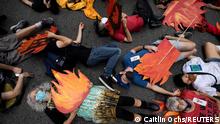 People block a street in Manhattan while pretending to be dead during a 'non-violent resistance' climate change protest organized by Extinction Rebellion in the Manhattan borough of New York City, U.S., September 17, 2021. REUTERS/Caitlin Ochs TPX IMAGES OF THE DAY