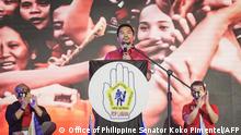 This handout photo taken on September 19, 2021, courtesy of the office of Philippine Senator Koko Pimentel shows Philippine boxer-turned-politician Manny Pacquiao (C) speaking during the PDP-Laban national assembly in Manila. (Photo by - / Office of Philippine Senator Koko Pimentel / AFP) / -----EDITORS NOTE --- RESTRICTED TO EDITORIAL USE - MANDATORY CREDIT AFP PHOTO / OFFICE OF SENATOR KOKO PIMENTEL - NO MARKETING - NO ADVERTISING CAMPAIGNS - DISTRIBUTED AS A SERVICE TO CLIENTS