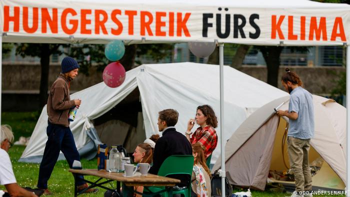 Climate activists pictured near a protest tent camp in Berlin