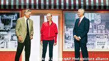 FILE - In this June 1, 2012 file photo, Jim Walton, left, Alice Walton, center, and Rob Walton, right, children of Walmart Inc. founder Sam Walton, attend a Walmart shareholders' meeting in Fayetteville, Ark. Since 2006, philanthropists and their private foundations and charities have given almost half a billion dollars to charter school groups, according to an Associated Press analysis of tax filings and Foundation Center data, with the Walton Family Foundation being the largest donor. (AP Photo/April L. Brown, file)