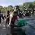 Migrantes haitianos cruzan el Río Grande