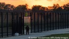 DEL RIO, TX - SEPTEMBER 17: A Texas Army National Guard member guards an opening in the border wall near a makeshift migrant encampment where thousands of migrants have gathered, causing U.S. Customs and Border Protection to close the point of entry between the U.S. and Mexico in response to an influx of immigrants on September 17, 2021 in Del Rio, Texas. According to a statement from the agency, the Del Rio point of entry will be temporarily closed to allocate more resources to the thousands of migrants staying in a makeshift encampment under a nearby bridge, with no specific timeline for reopening. Jordan Vonderhaar/Getty Images/AFP
== FOR NEWSPAPERS, INTERNET, TELCOS & TELEVISION USE ONLY ==