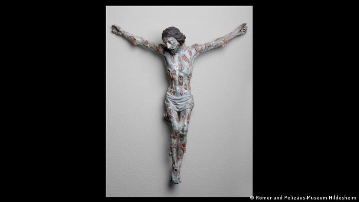 Ein Kruzifix, das Jesus mit Pestbeulen zeigt 